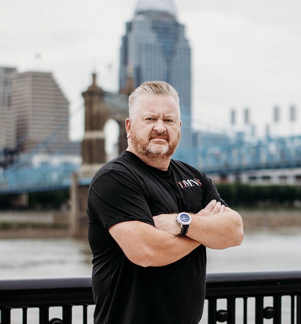 Gary Geiman, fractional CMO at DMN8 Partners, in front of the Cincinnati skyline